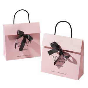 Branded paper bags with embossed logo for cosmetic and fashion retail, custom size and print available from Guangzhou factory